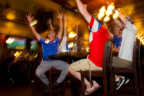 Fans celebrate a goal scored by the U.S. Women's soccer team.